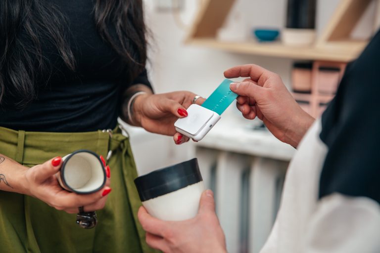 merchant-taking-sale-with-chip-and-swipe-reader-shopify-plus