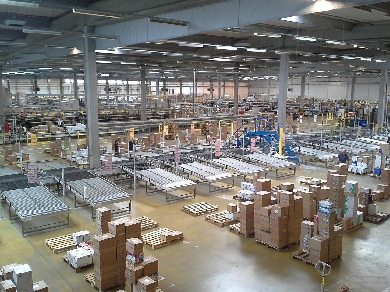 A factory with lots of boxes but no people to be seen